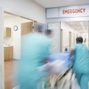 Emergency nurses rushing a patient into the ER Emergency nurses rushing a patient into the ER